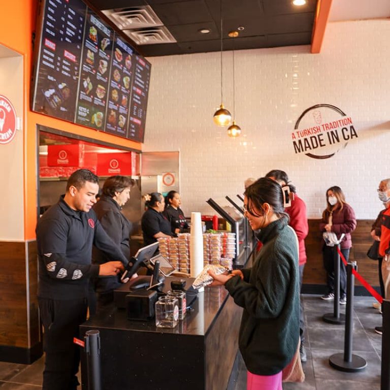 Busy donerg counter with customers.