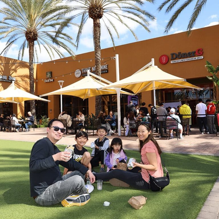 People enjoying a sunny outdoor at donerg