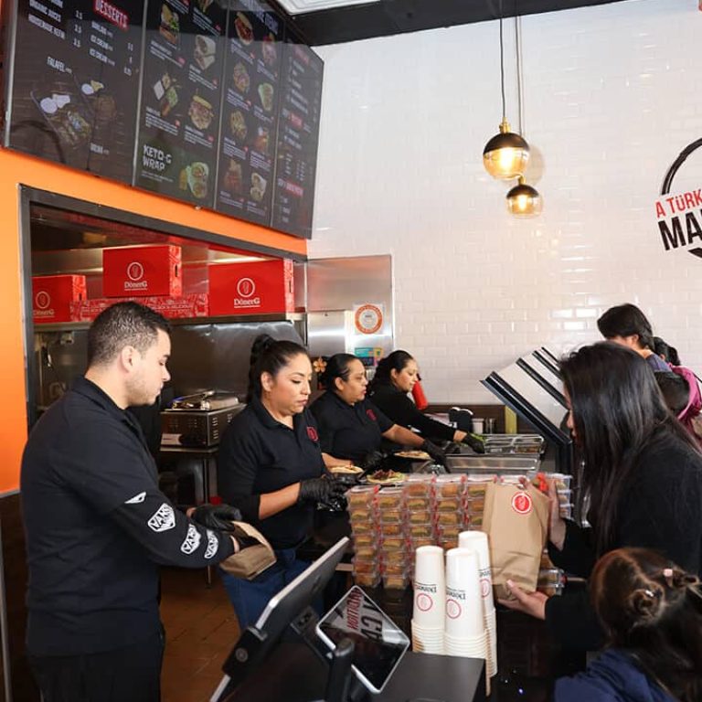 Busy donerg counter with staff serving